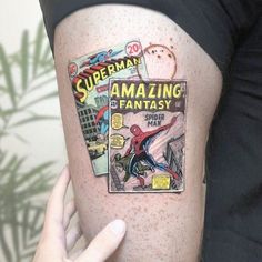 a person with a spiderman comic cover tattoo on their thigh