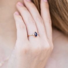 This beautiful natural blue sapphire is marquise shape and featuring in a 14k yellow gold prong setting and 14k yellow gold band. Diamonds are natural and sparkles. There are two clear diamonds each sides.The three stones represent (also called the Trinity or trilogy ring) represents friendship, love, and fidelity, or past, present, and future. DETAILS ABOUT THE RING, MATERIAL AND STONES***Center sapphire is marquise cut , 0.95 carat weight, 8 X 4mm.*** Sides diamonds are 2 mm size and 0.06 cara Sapphire Marquise Cut Promise Ring With Rose Cut Diamonds, 14k Gold Marquise Cut Sapphire Promise Ring, Marquise Yellow Gold 14k Birthstone Ring, Marquise Sapphire Diamond Ring, 14k Yellow Gold Marquise Birthstone Ring, Marquise Cut Sapphire Promise Ring, Gold Marquise Diamond Sapphire Ring, Marquise Sapphire Birthstone Ring For Anniversary, Marquise Sapphire Ring Birthstone For Anniversary