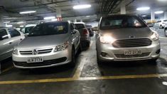 several cars are parked in a parking garage