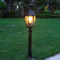 a lamp post in the middle of a lawn