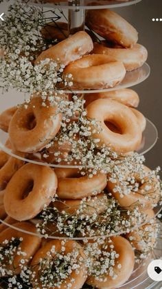 a stack of donuts with baby's breath sprinkles