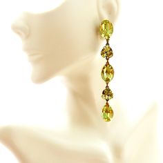 Long Yellow Rhinestone Dangle Earrings, Yellow Jewel Long Pierced Earrings, Jeweled Showgirl Earrings As the sun sets on a warm summer day, casting a golden hue over the horizon, these Long Yellow Rhinestone Dangle Earrings are the epitome of elegance. With a cascade of yellow jewels that dance delicately with each movement, these earrings are a true showstopper. Imagine wearing them to a glamorous gala, the soft glow of the evening lights reflecting off the rhinestones, making you the center of Elegant Yellow Dangle Clip-on Earrings, Green Linear Earrings For Parties, Green Drop Earrings For Party, Yellow Dangle Crystal Earrings For Party, Yellow Dangle Crystal Party Earrings, Elegant Yellow Crystal Earrings For Party, Yellow Drop Clip-on Earrings For Party, Elegant Yellow Crystal Dangle Earrings, Elegant Yellow Dangle Crystal Earrings