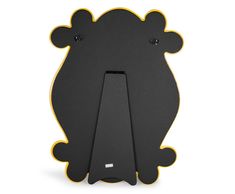 a black and yellow bear shaped phone holder on a white background with the back facing up