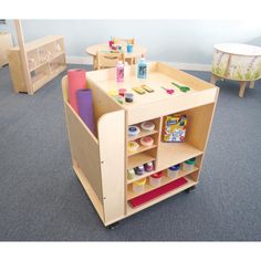 a child's play area with toys and furniture