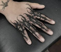 a person's hand with black ink on it