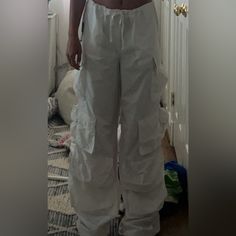 White Cargo Pants From Revolve. Never Taken Out Of Packaging So Tag Still On. Accidentally Ordered Two And Forgot To Return Second. Very Light And Airy. Run A Little Big. Adjustable Bottom So They Can Either Be Wide Leg Or Scrunched. Has Many Pockets. Size Medium Parachute Cargo Pants, Cargo Pants Color, Parachute Cargo, White Cargo Pants, Tan Trousers, Floral Trousers, Low Rise Pants, Belted Pants, House Of Harlow 1960