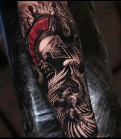 a man's arm with a black and grey tattoo on it, depicting an image of