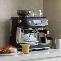 an espresso machine sitting on top of a counter