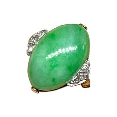 This is a stunning antique Art Deco Jade, Diamond and Platinum atop 14 Karat Yellow Gold Ring. The Wedding Ring, Engagement Ring or Cocktail Ring with a superb natural oval Jade Cabochon of great beauty is accented by 6 sparkling White Diamonds set in beautiful milgrain beaded borders in Platinum. The large oval jade cabochon is an exquisite gem. The jade is 19mm by 13mm by 7mm deep. On either side of the jade are three round diamonds each individually set in milgrain beaded borders in Platinum. The elegance of the diamond setting contrasting with the green of the jade is absolutely exquisite. The ring shank is 14 Karat Gold. The combination of the gorgeous jade, diamonds, platinum, and the wonderful form are the epitome of elegance. The ring is a classic jewel from the Art Deco period and Antique Jade, Platinum Diamond Rings, Wedding Engagement Ring, Antique Wedding, Ring Antique, Jade Ring, Diamond Settings, Art Deco Engagement Ring, Platinum Ring