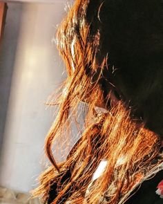 the back of a woman's head with long hair