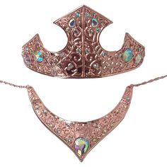 "This stunning Aurora inspired tiara and necklace set is made of gorgeous rose colored metal which is detailed in a floral vine designs and accented with ab crystals throughout. This crown /necklace set is perfect to complete your Aurora costume or cosplay Tiara measures 3\" tall in center 10.75\" with 2\" extender band Necklace Measures 2\" wide center 5.5\" widest part Adjustable chain fits up to 20\" Please note that this tiara and necklace are made of metal with the tiara having loops at the Frozen Princess Costume, Aurora Costume, Aladdin Party, Metal Crown, Band Necklace, Dragon Earrings, Princess Cosplay, Crown Necklace, Frozen Princess