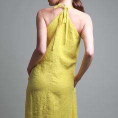 Look chic and sophisticated in this linen halter neck midi dress. Crafted from breathable premium linen, the gently flared silhouette features tie straps and an open back that adds a structured yet relaxed touch. Perfect for those many occasions in warm summer days.  Shown in Lemon Yellow medium weight linen. FEATURES       *  Gentle A-line       *  Midi length       *  Double layered upper       *  Hidden side pockets SIZING Please consult the size chart photo. For specific sizing recommendatio Linen Halter Neck Maxi Dress, Elegant Linen Halter Neck Dress, Chic Linen Halter Dress For Summer, Chic Summer Linen Halter Dress, Chic Halter Neck Linen Maxi Dress, Linen Halter Neck Dress With Tie Back, Chic Linen Halter Neck Dress, Linen Halter Neck Sundress, Spring Linen Halter Dress For The Beach