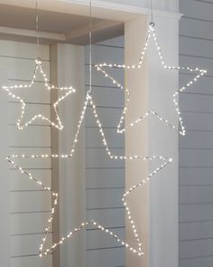 three star lights hanging from the ceiling