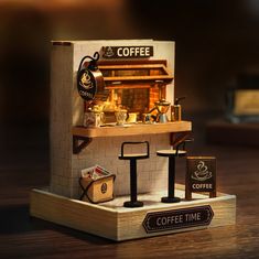 a miniature coffee shop is set up on a table