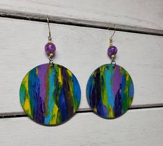 Gotta love these multi-colored earrings! These earrings were handpainted and feature original artwork. The circle is 1-3/4 inch in diameter. Add some fun! Artsy Hand Painted Colorful Earrings, Adjustable Multicolor Round Earrings, Fun Multicolor Hand Painted Earrings, Multicolor Hand Painted Fun Earrings, Artsy Multicolor Hoop Earrings For Gift, Multicolor Artsy Hoop Earrings As Gift, Artsy Multicolor Hoop Earrings As A Gift, Fun Hand Painted Colorful Earrings, Handmade Colorful Circular Earrings