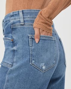 This ultra high-waisted wide leg has an easy, relaxed fit and an ankle length silhouette. This pair is crafted from our PAIGE VINTAGE denim in the perfect light wash with lived-in distressing, natural fading, set in front pockets, double belt loops and a raw hem. PAIGE Vintage takes all of the work out of breaking in your favorite pair of vintage jeans. We've combined the comfort of stretch with everything you love about authentic vintage denim to create super soft jeans that feel perfectly lived-in from the very first wear. Distressed High Rise Cropped Jeans In Washed Blue, High Rise Washed Blue Distressed Cropped Jeans, High Rise Distressed Washed Blue Cropped Jeans, Everyday Light Wash Distressed Flare Jeans, Faded Ripped Everyday Bottoms, Everyday Faded Ripped Bottoms, High Rise Faded Distressed Flare Jeans, Distressed High Waist Light Wash Flare Jeans, Ripped High Rise Cropped Jeans For Everyday