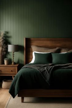 a bedroom with green walls and wooden furniture