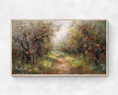 an apple orchard painting hanging on the wall