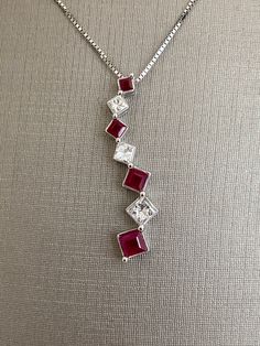 14 Karat White Gold Ruby and Diamond Square Shape Necklace Ladies Pendant For Her 18 inch chain length 3.1 grams Square Ruby Necklace, Ruby And Diamond Pendant, Formal 16 Inch Pendant Jewelry, Formal Red Square Pendant Necklace, Elegant Square Pendant Necklace With Lobster Clasp, Anniversary Necklace With Square Pendant And Box Chain, Anniversary Necklace With Square Pendant And Adjustable Chain, Anniversary Box Chain Necklace With Square Pendant, Anniversary Dangle Necklaces With Lobster Clasp