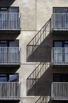 an apartment building with balconies and windows