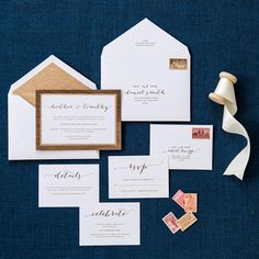 the wedding stationery is laid out and ready to be put into their guests'envelopes