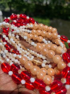 Double Strand Waist Bead "Abengourou" – an exquisite creation meticulously handcrafted with pristine white glass crystal seed beads, adorned with accents of passionate red glass seed beads. This double-strand waist bead embodies purity and elegance, offering a graceful and adjustable fit that transcends beauty and symbolism. ⚪ White Glass Crystal Seed Beads - Timeless Purity: Abengourou is adorned with pristine white glass crystal seed beads, creating an aura of timeless purity. The pristine white hue symbolizes serenity and clarity, adding a touch of refined elegance to your ensemble. 🔴 Red Glass Seed Bead Accents - Passionate Highlights: Intertwined among the ivory beads are accents of passionate red glass seed beads, infusing Abengourou with vibrant highlights. The red color symbolizes Red Coral Beaded Necklaces With Spacer Beads, Red Double Strand Faceted Beaded Necklaces, Red Double Strand Faceted Beaded Necklace, Red Double Strand Beaded Necklace With Faceted Beads, White Beaded Waist Beads As A Gift, White Beaded Waist Beads As Gift, Red Double Strand Beaded Necklaces, Red Double Strand Beaded Necklace With Polished Beads, Red Coral Spacer Beads, Round Shape