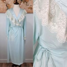 Vintage 1970s Era Polyester Mint Or Seafoam Green Maxi Length Nightgown Robe. Elegant House Robe With Matching Waist Tie And Lace Detailing. Brand New Condition, Original Tag Still Attached! Size Medium. Bust 30" But Variable With The Waist Tie Length 50" Vintage V-neck Nightgown For Loungewear, Vintage V-neck Nightgown For Spring, Vintage Spring Sleepwear For Home, Vintage Spring Sleepwear, Vintage Lace Trim Nightgown For Spring, Vintage Spring Robe With Lace Trim, Vintage Lace Trim Robe For Spring, Vintage Spring Robe For Home, Vintage White Daywear Robe