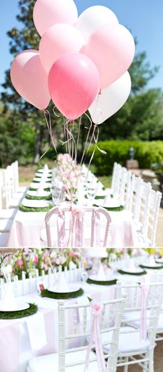 there are many pink and white balloons on the table