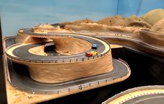 there is a model car track set on display