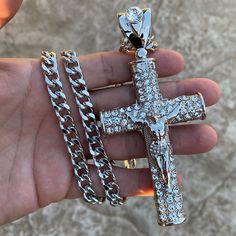 Men's huge crucifix cross hip hop chain. 30" x 8mm cuban chain with a lobster lock. Silver tone rhodium plated over alloy metal. Huge pendant is 4.75" tall w/bale, 2.25" wide. Pendant iced with dazzling round-cut stones. Sturdy well made pendant has a caged back. Solid neck piece good weight at 170 grams. 100% FREE SHIPPING in USA. Order now!. Silver Cross Necklace With Figaro Chain, Silver Cross Necklace With Curb Chain, Silver Cross Chain Necklace With Curb Chain, Silver Cross Curb Chain Necklace, Silver Crucifix Necklace With Figaro Chain, Silver Crucifix Figaro Chain Jewelry, White Iced Out Cross Necklaces, Streetwear Jewelry With Cross Pendant Chain, Streetwear Cross Pendant Chain Jewelry