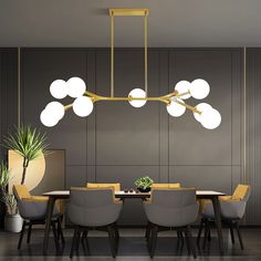 a dining room table with chairs and a chandelier hanging from it's ceiling