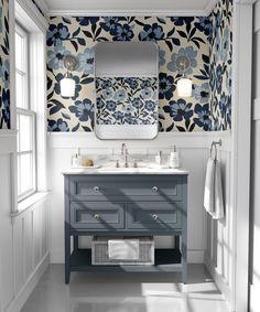 a blue and white bathroom with floral wallpaper