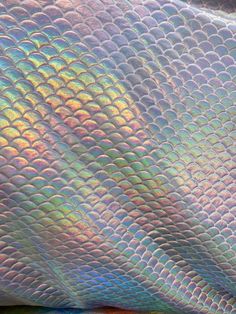 Amazing 4-Way Stretch Mermaid Hologram Spandex Fabric.  Metallic foil scales cover high quality Nylon/Spandex base fabric, with a great 4-way stretch. This material is ideal for apparel, swimsuits, dance wear, and so much more.  Hand washing is recommended for this fabric, and actual colors may vary due to differences in individual computer monitor settings. We offer continuous yardage if you need more than one yard, with a quantity discount on orders of ten yards or more. Simply enter the total Iridescent Mermaid Tail, Iridescent Scales, Irridecent Fabric, Holographic Fabric Wallpaper, Iridescent Fish, Iridescent Pearl, Mermaid Life, Iphone Wallpaper Girly, Metallic Foil