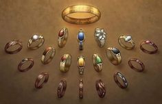 a bunch of rings that are sitting in the middle of a table with one ring on it's side