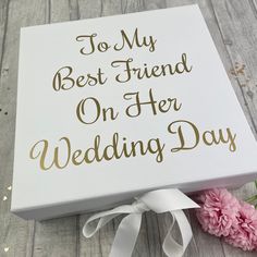 a white box with the words to my best friend on her wedding day next to pink carnations