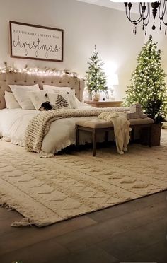 a bedroom decorated with christmas trees and lights