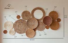 a wall with some baskets on it and measurements for each item in front of it