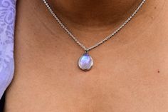 Embrace the Divine with this fine quality moonstone crystal Necklace. This stunning dainty genuine Moonstone necklace features fine quality moonstone smooth teardrop cabochon with Blue color flashes. all held together by 925 solid sterling silver. could turn out to be a best gift for this mother's day to make her feel young again. Wearing a Moonstone crystal necklace will surround your body with positive and healing energies that will prevent any misfortunes coming your way. You can use this Chr Moonstone Teardrop Pendant Jewelry Gift, Teardrop Moonstone Necklace With Birthstone, Elegant Teardrop Moonstone Necklace, Teardrop Necklace With Moon Charm As Gift, Teardrop Moon Charm Necklace As Gift, Teardrop Moon Charm Necklace For Gift, Handmade Moonstone Teardrop Necklace, Dainty Moonstone Teardrop Pendant Necklace, Handmade Teardrop Moonstone Necklace