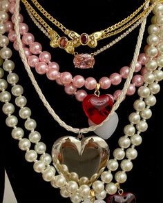 Super Glazed and Super glossy! This is our take on the classic pearl necklace -- choose between pink or elegant white glass pearls, and a cherry red heart or milky white heart charm! Both equally juicy, of course. Pink pearl option measures at around 15" long with extender, and white pearl option available in both 15" and 17" long with extender. White Heart-shaped Pearl Charm Necklace, White Heart-shaped Pearl Necklace With Charm, Elegant Heart-shaped Pearl Necklace With Heart Charm, Big Heart Necklace, Valentine's Day Heart-shaped Pearl Charm Necklace, Heart-shaped Pink Pearl Necklace, Classic Pearl Necklace, Gold Heart Locket, Lucky Charm Necklace