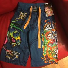 This Is A Pair Of Men’s New Cotton Knit Sleep Pants From Don Ed Hardy By Christian Audigier In A Size Xs With The Tags. Pull-On Style With Elastic In The Waist And Built In Ties, Tag Says Waist Size 24-26. Tigers, Snakes, Flame Design. Gold Embroidery. 100% Cotton. The Blue Is More Vivid Than In The Photos. They Measure 23” From The Waist To The Hem. Retail Price $99. Blue Graphic Print Bottoms For Summer, Sporty Blue Bottoms With Graphic Print, Casual Blue Graphic Print Bottoms, Casual Blue Shorts With Graphic Print, Blue Casual Shorts With Graphic Print, Fitted Blue Shorts For Streetwear, Blue Graphic Print Beach Bottoms, Blue Stretch Shorts For Streetwear, Casual Blue Graphic Print Shorts