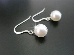 Simple Swarovski pearl bridesmaid earrings. Needing a bridesmaid gift or bridesmaid jewelry, this is a simple pearl earring that will be perfect without breaking the bank.  Elegance and grace. Simple pearl drop earrings are designed with Swarovski pearls and sterling silver.  Bridal jewelry and bridesmaid gifts by Celebrating Together.  #bridalearrings #pearldropearrings #bridesmaidearrings #bridemaidgift #bridesmaidproposal Pearl Bridesmaid Earrings, Simple Pearl Earrings, Bridesmaid Pearls, Bridal Earrings Drop