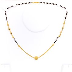 This Mangal Sutra, crafted in 22k yellow gold and weighing 8.9 grams, features an intricate design with dangling orbs and black bead embellishments. The necklace length is 17 inches, ideal for a graceful and elegant appearance. Secured with an 'S' lock, this piece beautifully combines traditional cultural elements with a unique, modern twist, making it perfect for those who value both heritage and contemporary design in their jewelry. PRODUCT DETAILS Gold Purity(karat): 22k Item Weight(grams): 8 Mangal Sutra, Intricate Design, 22k Gold, Necklace Length, Black Beads, Contemporary Design, Necklace Lengths, Embellishments, Twist