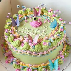 there is a cake decorated with flowers and butterflies