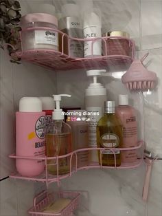 pink bathroom shelves with soaps, lotions and other personal care products on them