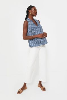 The Denim Stripe Veronica Top is a perfect warm-weather style for everything from work to play. This tank features a ruffle V-neckline, a slight A-line silhouette, and an eye-catching chevron pattern. Pair with denim for a monochromatic look, or with white jeans and sandals for a breezy summer style. Ruffle V-neckline Sleeveless A-line silhouette Lined Material: 65% Cotton, 35% Polyester (outer), 100% Cotton (lining) Care: Hand wash cold, do not bleach, hang to dry, low iron Indigo V-neck Top For Spring, Loeffler Randall, Cocktail Attire, Weekend Wear, Chevron Pattern, Night Looks, Pullover Sweatshirts, White Jeans, Clothes For Sale