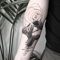 a person with a tattoo on their arm