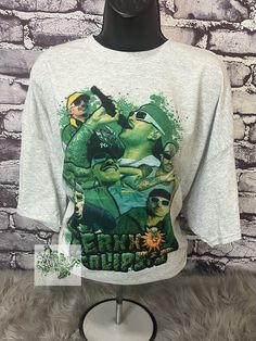 Ferxxo Tour Shirt 💚 This is a sublimation shirt, high quality ink transferred to t-shirt so there is a no feel design. The sublimation design is meant to look vintage and slightly faded. Soft and comfy t-shirts are high quality unisex shirts. The unisex sizes are retail fit and can be a little bit relaxed.  If you have a special request, please message me prior to purchasing.  Your shirt will be ready to ship within 7-14 days -- Care Instructions -- * Turn Inside Out * Wash In Cold/Warm Water * Use Mild Detergents * Tumble Dry Low Heat  **Please Make sure you have the correct address prior to purchasing** (Not held accountable for any shipping delays made by carrier) We also accept custom orders! **DUE TO VARIATIONS ON COMPUTER MONITORS CONFIGURATION, COLORS MAY VARY SLIGHTLY FROM PICTURE Green Band Merch Top With Sublimation Print, Pop Culture Sublimation Print Top For Streetwear, Band Merch Printed Tops For Streetwear, Grunge Custom Print Tops For Fan Merchandise, Grunge Tops With Custom Fan Merchandise Print, Grunge Tops With Custom Print For Fans, Pop Culture Shirt With Sublimation Print For Streetwear, Custom Print Band Merch Tops For Streetwear, Hip Hop Tops With Sublimation Print For Fan Merchandise