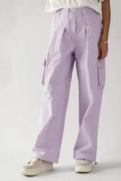 Stay on-trend with our versatile cargo pants. Made of durable 100% nylon, the pants feature waist cord locks and side pockets for maximum utility. The wide leg silhouette offers a relaxed fit and modern look. Perfect for outdoor activities, casual wear, or travel, these pants are available in sizes S-L. Upgrade your wardrobe with this must-have staple. Cargo Pants, Outdoor Activities, Must Haves, Casual Wear, Outfit Ideas, Lavender, Wide Leg, Relaxed Fit, My Style