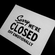 a close up of a sticker on a black background that says sorry we're closed