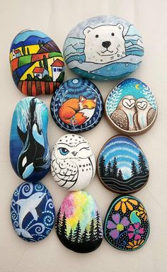 a group of painted rocks sitting on top of a table